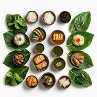 A circular arrangement of different types of food on leaves photo