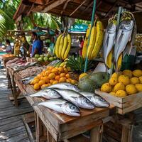 A fruit and vegetable stand with fish, bananas, and oranges photo