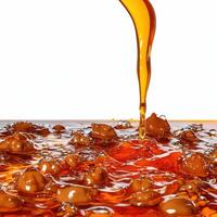 A close up of a liquid being poured into a bowl photo