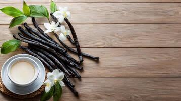 Vanilla beans and cup of coffee on wooden table top view photo