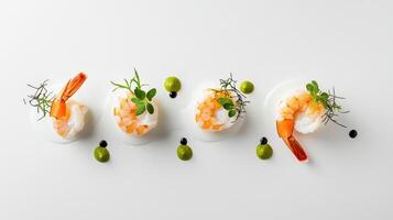 Three shrimp on a white plate with olive oil and herbs photo