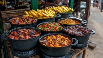 A variety of food is displayed in black pots photo