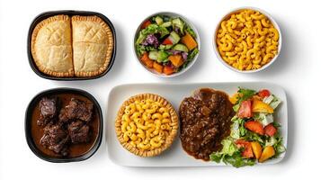 A variety of food items including meat, pasta, and vegetables photo