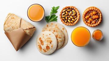 Various types of food including bread, cheese, and orange juice photo