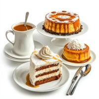 A white table with four plates of desserts photo