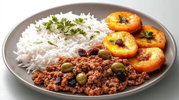 A plate of rice, meat, and vegetables photo