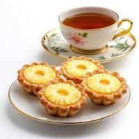 A plate with four pineapple tarts on it photo
