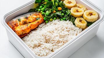 A white container with rice, vegetables and bananas photo