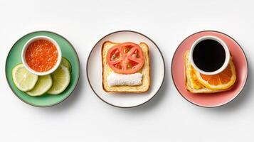 Three plates with sandwiches, tomato slices and a cup of coffee photo
