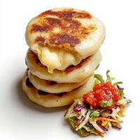 A stack of pancakes with a side of salad photo