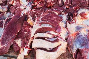 Meat on the counter at the market. Assortment of raw meat, beef. photo