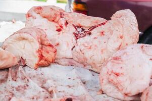 Meat on the counter at the market. An assortment of raw meat with fat. photo