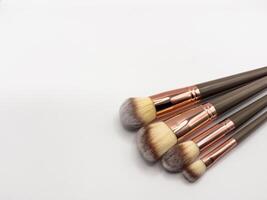 A set of black makeup brushes isolated cutout on white background, copy space, flat lay, top view photo