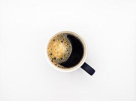 A cup of espresso coffee. View from above. Isolated on white background. Flat lay. Top view, copy space. photo