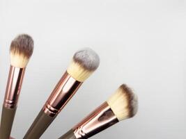 Set brush for cosmetics is isolated on a white background. Concept of care of skin, copy space, flat lay, top view photo