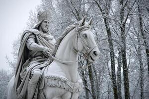 Equestrian statue of saint stephen, king of hungary, covered in snow during winter photo
