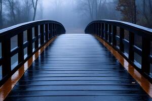 Wooden bridge in the fog disappearing into the distance photo