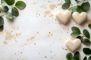 Heart-shaped objects and eucalyptus leaves creating a stylish background photo