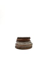 Different sizes of coin stacks are arranged neatly against a white background, copy space photo