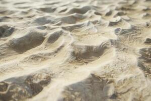 Rippled sand texture creating abstract patterns on beach photo