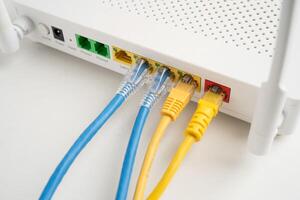 Ethernet cable with wireless router connect to internet service provider network. photo