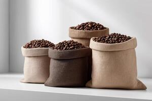 Four Burlap Sacks of Dark Roasted Coffee Beans on White Surface photo
