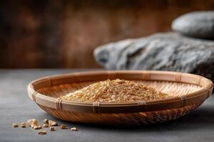 Golden Grains in Rustic Bamboo Basket on Dark Background photo