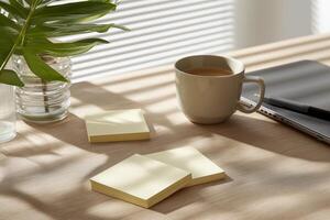 Sunlit Workspace Beige Desk with Yellow Sticky Notes and Coffee photo