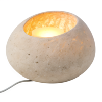 A ceramic table lamp shaped like a smooth river stone with a warm inner glow, on a transparent background png