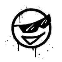 Smiling face emoticon character with sunglasses. Spray painted graffiti smile face in black over white isolated on white background vector