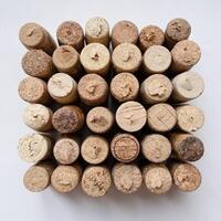 square made of wine corks on white background, geometric textured pattern photo