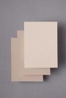 rectangular cardboards at different levels hanging in the air, on a blue background, mock-up, space for text photo