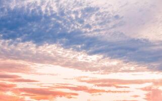 Sunset cloudy sky with beautiful color gradient. Cloud landscape, background. photo