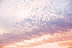 Sunset cloudy sky with beautiful color gradient. Cloud background. photo