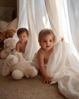 Two toddlers playing peek-a-boo behind sheer curtains. photo