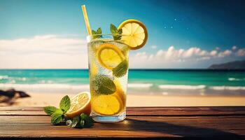 Citrus lemonade with lemon and lime slices on a wooden table by the sea photo