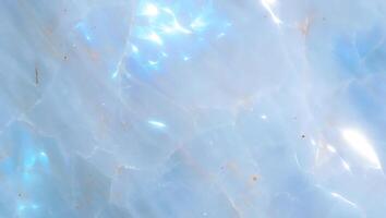 Soft ethereal blue quartz texture with natural patterns and subtle light reflections suitable for backgrounds and digital designs. photo