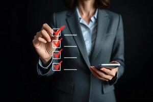Businesswoman in a suit completing a checklist with red check marks on a transparent screen with a smartphone photo