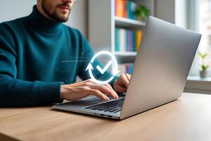 Man working on a laptop with a visual confirmation symbol suggesting successful completion of a task or project. photo