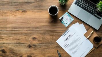 Organized workspace documents atop a wooden surface. photo