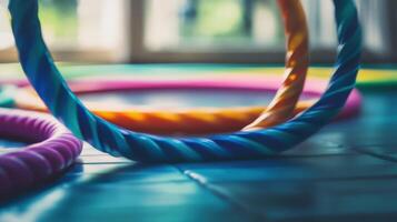 Close-up view of colorful plastic jump ropes on tiled floor. photo
