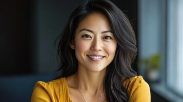 Smiling woman in a mustard yellow top, a portrait. photo