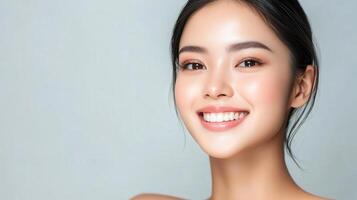 Beautiful asian woman smiling with clean skin photo