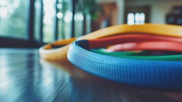 Colorful exercise rings on a wooden floor. photo