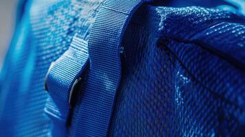 Closeup view of a vibrant blue backpack strap. photo