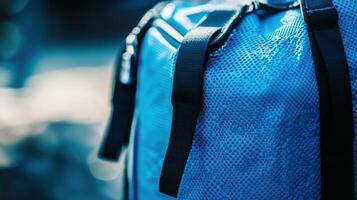 Close-up view of a vibrant blue waterproof bag. photo