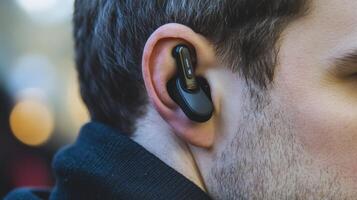 Close-up view of in-ear headphones nestled in the human ear. photo