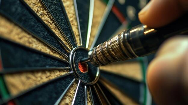 Close-up view of a dart hitting the bullseye. photo