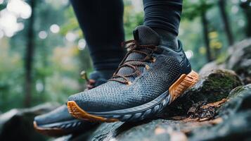 Close-up of hiking footwear on a rocky trail. photo