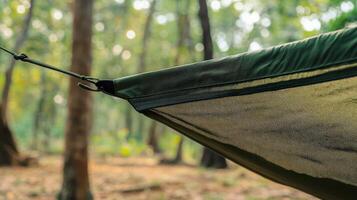 Close-up of a hammock's mesh netting in a forest. photo